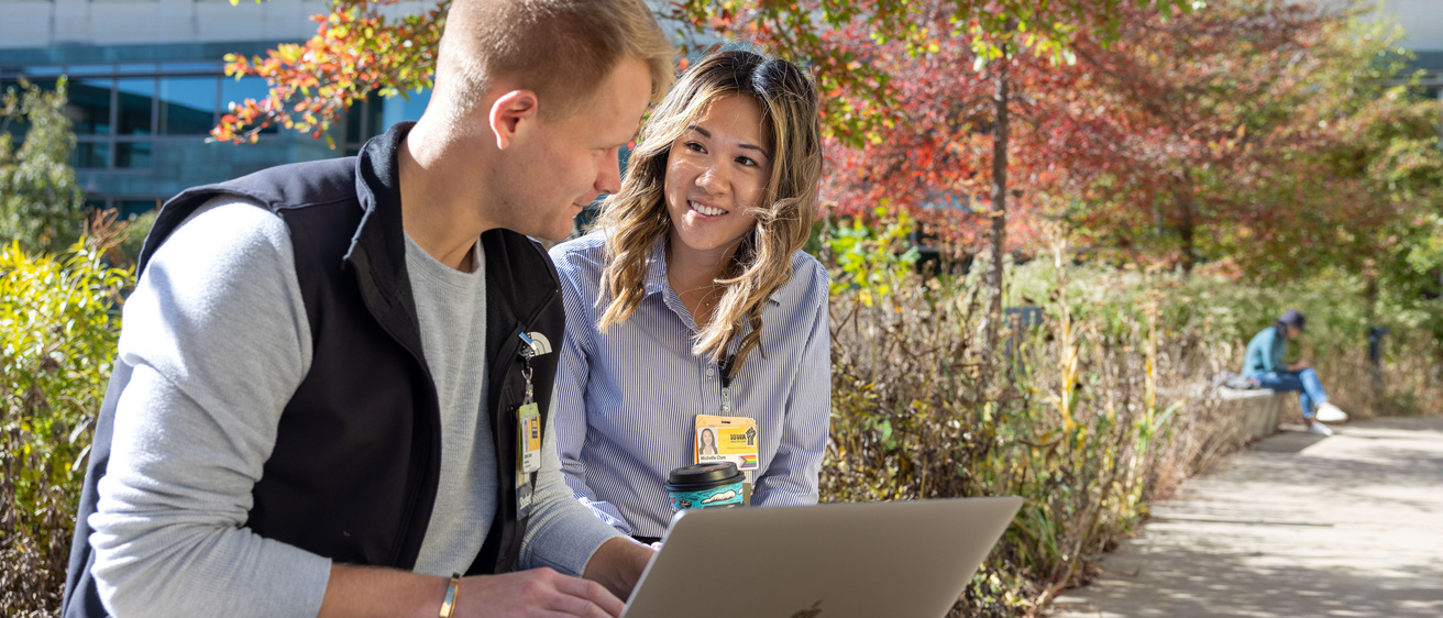 Medical students Michelle Chen, Harrison Parker, Spenser Larson on the Carver College of Medicine campus with fall foliage on Thursday, Oct. 24, 2024.