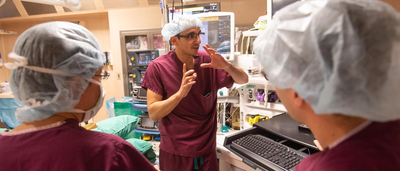 Pictures of Neurosurgery residents working with faculty.