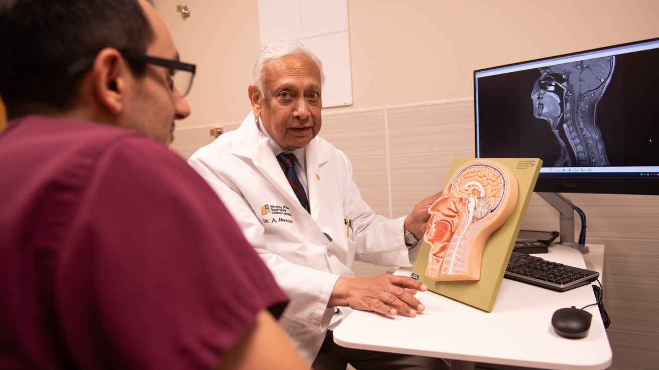 Pictures of Neurosurgery residents working with faculty.